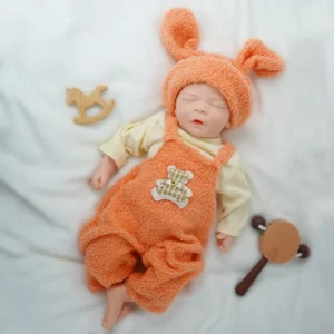 17.9-inch all silicone reborn baby girl -2.9 kg real weight. Has a natural deep sleep expression and a slightly open mouth.